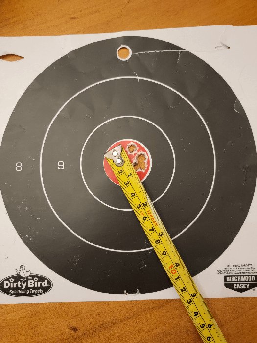 5 shot group with my .308 at 100 yards. The flyer was my third ... (target showing a rifle 5-shot group)
