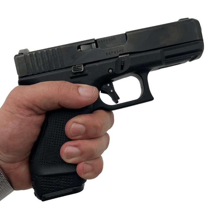 XTech MAG-ADAPT 19-17 sleeve showing a magazine adapter for Glock 19/23/32—visual representation of using mags from other Glock models (compatibility/adapter for extended or different-model magazines).