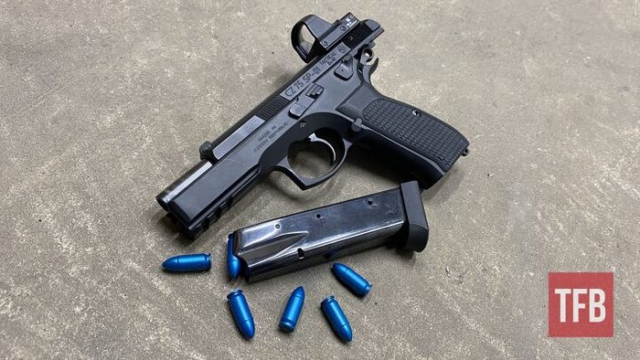 Article image showing a handgun with snap caps used for dry-fire practice — illustrates safe at-home dry-fire setup and snap-cap training for beginners.