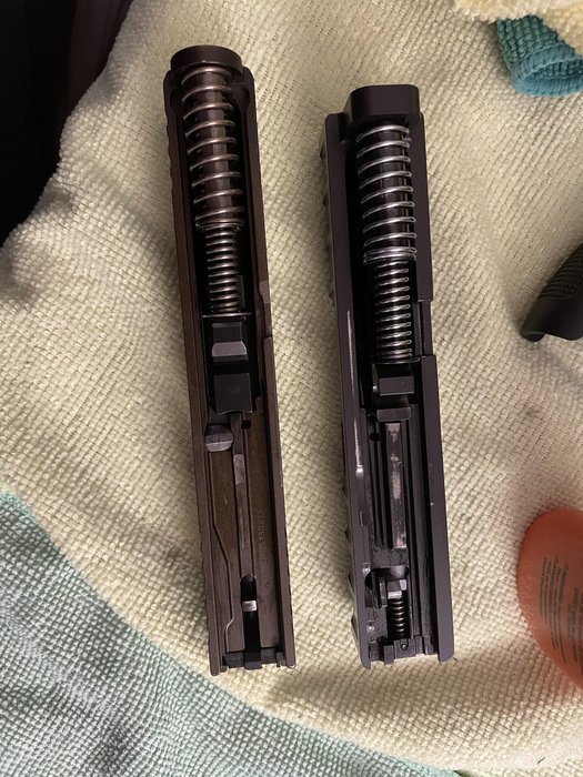 Normal wear? APX carry slide on the right with ~100 rounds ... — shows visible slide finish wear comparing used slide, representing durability and long-term wear observations.