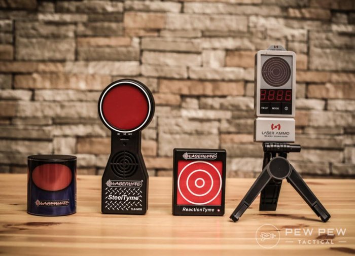 Best Laser Targets & Ammo for Dry-Fire Training — laser training targets with visible laser impacts, representing low-light and dry-fire distance practice drills.