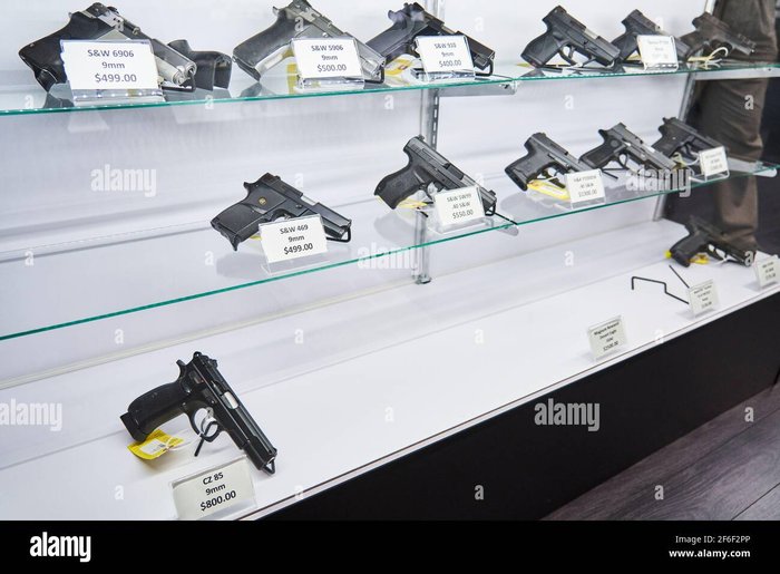 Price gun tag hi-res stock photography and images - Alamy (handguns with labels and price tags on sale on shelves at a gun store)